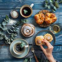 Table With Pastries and Coffee Cups photo