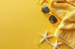 Towel, Sunglasses, and Starfish on Yellow Background photo