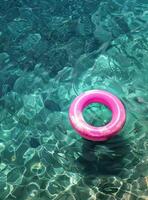 Pink Ring Floating on Water photo
