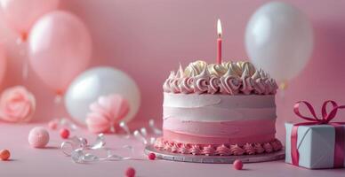 Birthday Cake With Pink Frosting and Lit Candle photo
