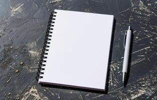 Notebook and Pen on Desk photo