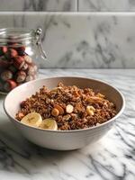 Healthy Breakfast Bowl With Granola, Bananas, and Nuts photo