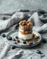 Glass Jar Filled With Granola and Blueberries photo