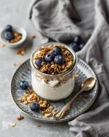 Glass Jar Filled With Granola and Blueberries photo