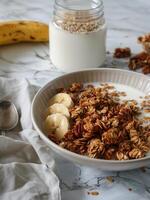 A Bowl of Granola and a Glass of Milk photo