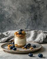 Glass Jar Filled With Granola and Blueberries photo