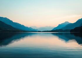 Majestic Mountains Overlooking Serene Body of Water photo