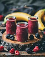 Three Jars of Raspberry Smoothie With Bananas and Raspberries photo