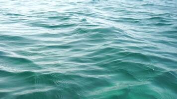 Sea water surface. Camera flies over the calm azure sea. Nobody. Holiday recreation concept. Abstract nautical summer ocean nature. Weather and climate change. Slow motion. Close up video