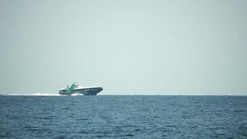 A high speed boat is sailing in the calm ocean. video