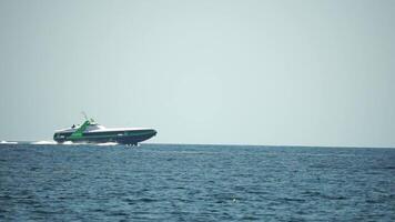 A high speed boat is sailing in the calm ocean. video