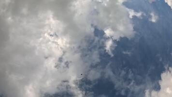 Timelapse fluffy Cumulus clouds moving in bright sunset. Abstract aerial nature summer ocean sunset, sea and sky view. Vacation, travel, holiday concept. Weather and Climate Change video