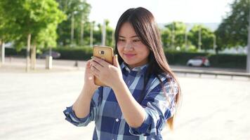 Young Asian Woman Using Smart Phone Tablet In the City Streets video