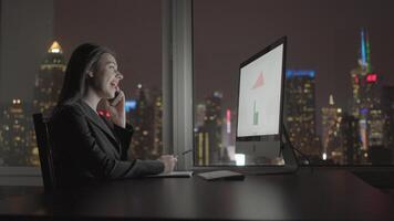 Young Confident Woman Working in Modern Office on Computer Desk At Night video