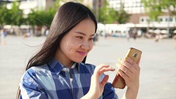 Young Asian Woman Using Smart Phone Tablet In the City Streets video