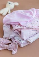 Stack of Baby bodysuits. photo