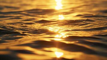 The warm golden light of the sun casting a serene glow over the stillness of the ocean waters photo