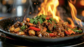 A sizzling plate of y Thai curry adorned with tender slices of beef and a rainbow of vegetables all coated in a vibrant and fiery sauce. The e level is sure to make you brea photo