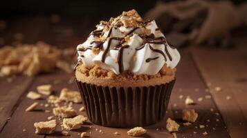 Get ready to sink your teeth into this delightful cupcake rich chocolate creamy marshmallow and a crunchy graham cracker crust all in one bite photo