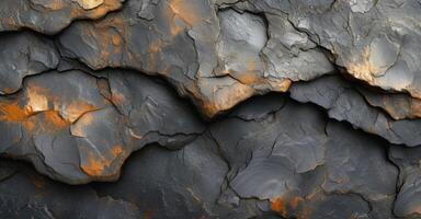Texture of lava dripping and clinging to a smooth rock surface leaving behind a glossy and marbled look photo