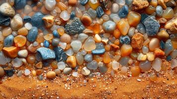 Texture of tiny pebbles and rocks embedded within a sandy beach creating a rugged and textured surface photo