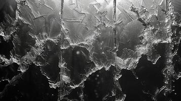 Texture of icy patterns on a window Intricate weblike designs stretch across the gl created by the frozen condensation of breath and adding a delicate frosty touch to th photo