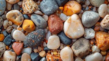 Closeup of tiny pebbles mixed into the soft sand adding a rough texture photo