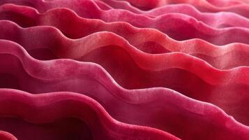 Closeup of layers of overlapping ripples on a burgundy fabric resembling the layers of red rock formations photo