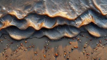 Closeup of grains being carried by the strong winds creating a mesmerizing pattern in the sand photo