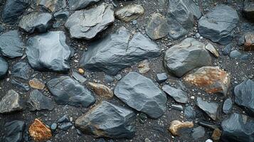 Texture of a pebblecovered beach the dark and light shades of gray blending together in a mosaic of windblown patterns photo