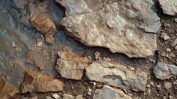Closeup of the evolving textures in a bubbling brook from rough pebbles to smooth stones and from gentle currents to turbulent rapids photo