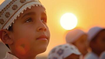 The excitement and anticipation of children as they eagerly wait to spot the new moon signaling the end of Ramadan and the beginning of Eid alFitr photo