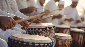 The joyful sounds of drums and music filling the air as families and friends gather for Eid celebrations and share in traditional dances and songs photo