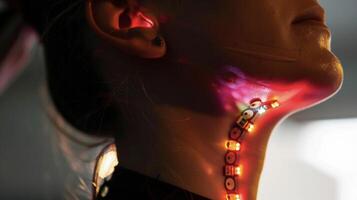 A closeup of a neck tattoo with embedded sensors that track respiratory rate and oxygen levels providing important data for those with respiratory conditions photo