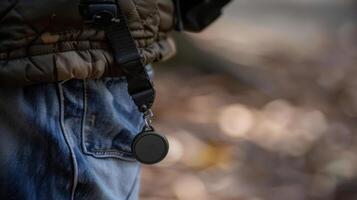 A compact portable panic button attached to a keychain allowing seniors to have quick access to the IoTenabled safety system wherever they go photo