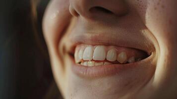 A closeup of a persons face wearing a smile while using a telerehabilitation platform to participate in a remote group therapy session with realtime feedback and support fro photo