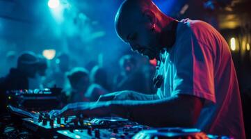 DJ is playing modern electronic music at a popular nightclub photo