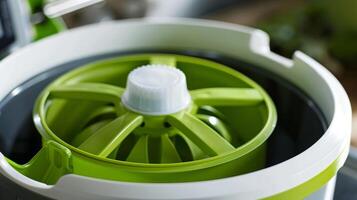 The rubber grip on the crank of the salad spinner designed for comfortable and easy use photo