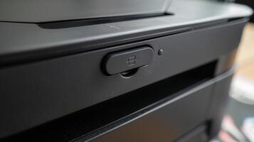 A closeup of the jam release button in case of any paper mishaps photo