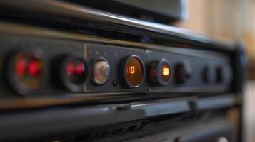 A closeup of the temperature control on the top of the oil heater labeled with numbers ranging from 110 photo