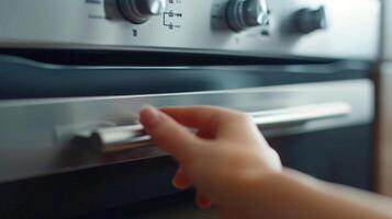 Macro shot of the microwaves touchsensitive buttons with a finger pressing down on one of them photo
