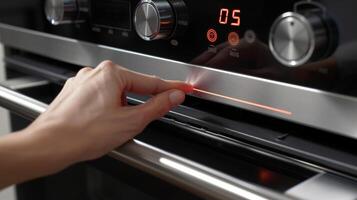 un Temporizador botón siendo empujado en un convección horno con un brillante rojo monitor contando abajo el Cocinando hora foto