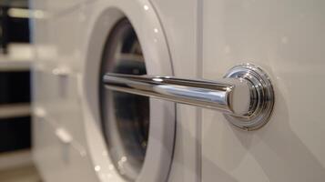 The door handle smooth and is used to open and shut the dryer before and after use photo