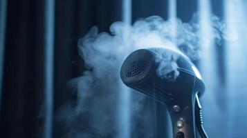 A macro shot of the steam head on a garment steamer showing how the powerful burst of steam helps to remove wrinkles photo