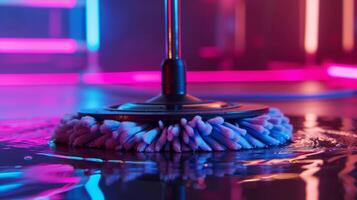 The mops rotating head equipped with multiple spinning brushes able to clean even the toughest of floors photo