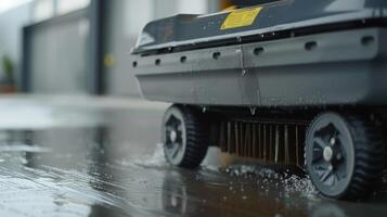 A shot of the brooms wheels allowing for smooth movement and reduced strain on the users arm photo