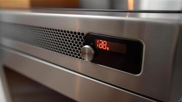 A closeup of the builtin timer feature on the heater allowing users to set a specific time for it to turn on or off photo
