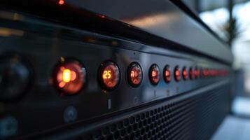 A closeup of the temperature settings on a panel heater with numbers ranging from 1 to 10 and a red indicator light next to the currently selected level photo