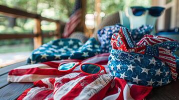 The table showcases a variety of American flagthemed clothing and accessories from bandanas to sunglasses perfect for showing off your pride on Independence Day photo