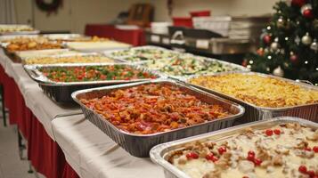 A folding table set up in a church hall overflowing with trays of hearty casseroles steaming soups and festive desserts prepared by members of the community for a charitabl photo